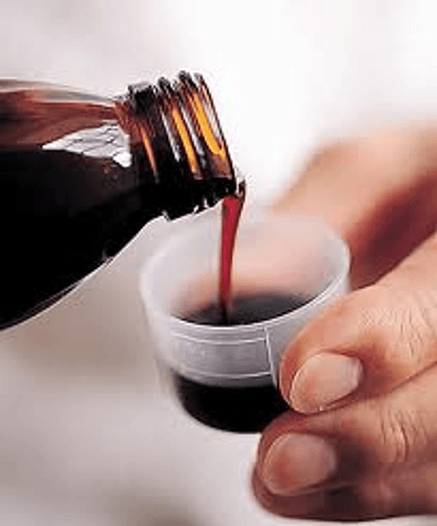 pouring-medicine-in-the-cup