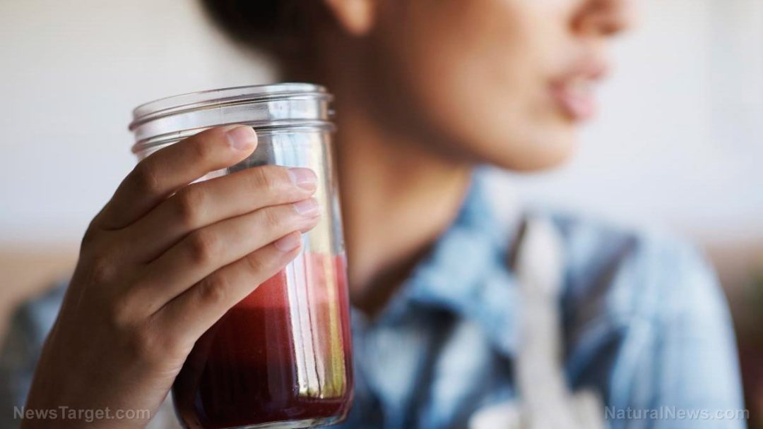 Woman-Glass-Fruit-Smoothie-Close-Up