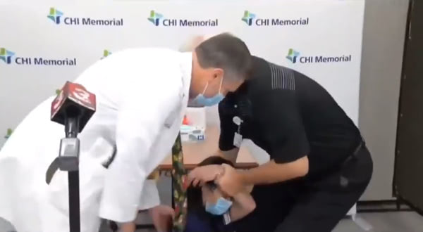 Nurse Passes Out Covid Vaccine