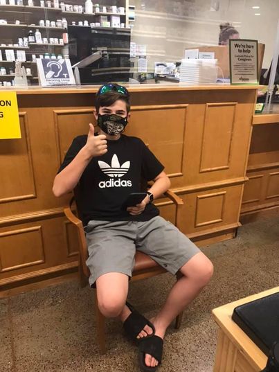 child’s mother, Jennifer O’Drain, shows him giving a thumbs up from a doctor’s office along with the caption, “Sec shot done.”